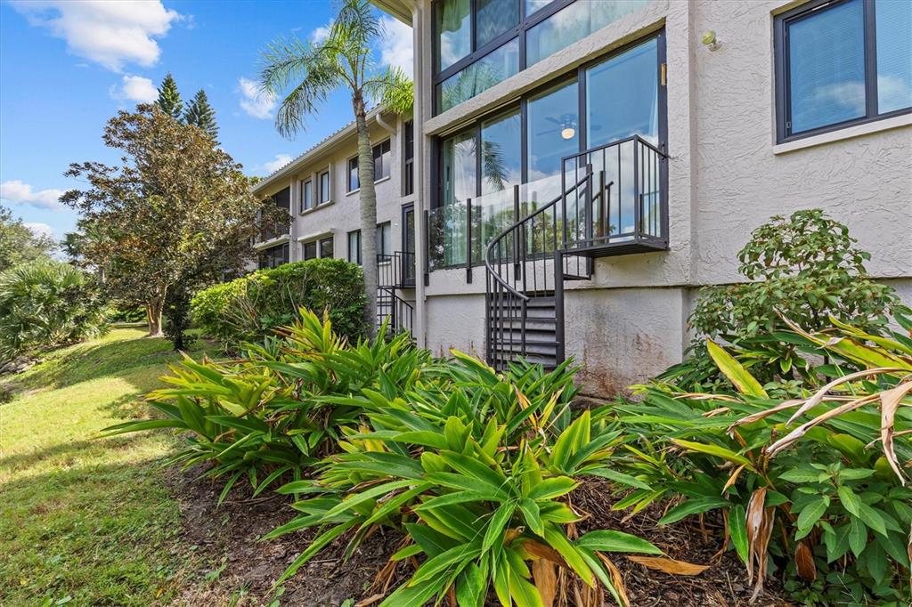 1800 Mariner Drive, Unit 9 Tarpon Springs, FL 34689 - Photo 29 of 41 a front view of a house with garden