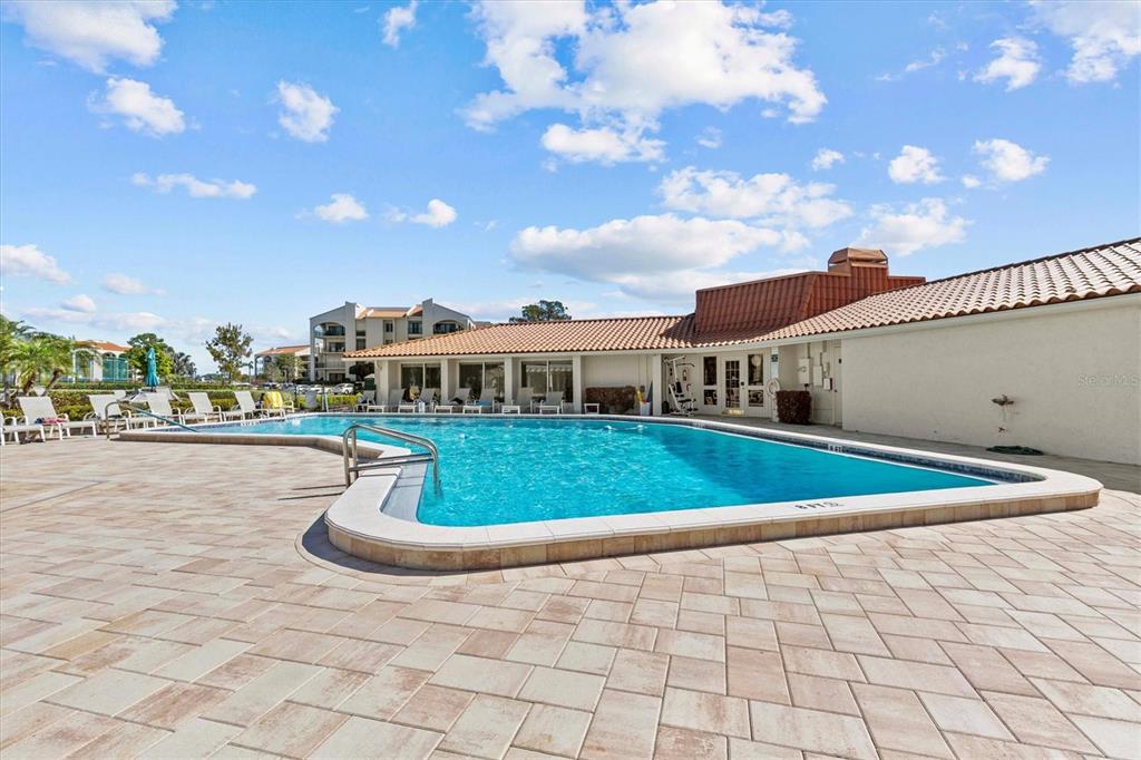 1800 Mariner Drive, Unit 9 Tarpon Springs, FL 34689 - Photo 31 of 41 a front view of a house with a yard