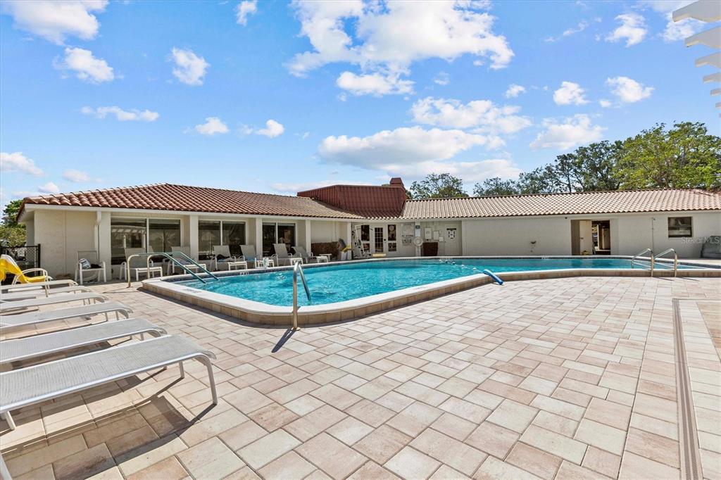 1800 Mariner Drive, Unit 9 Tarpon Springs, FL 34689 - Photo 32 of 41 a view of house with yard outdoor seating and barbeque oven
