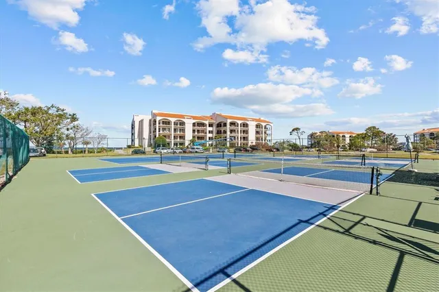 a view of an outdoor space and tennis court