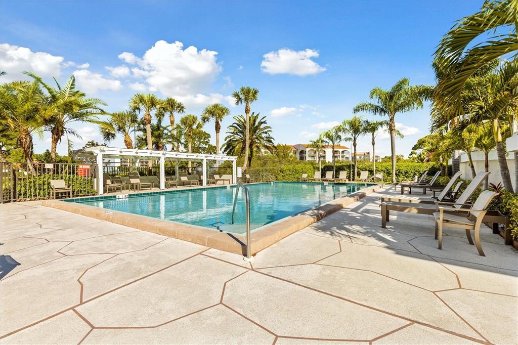 1800 Mariner Drive, Unit 9 Tarpon Springs, FL 34689 - Photo 38 of 41 a view of swimming pool with outdoor seating and city view