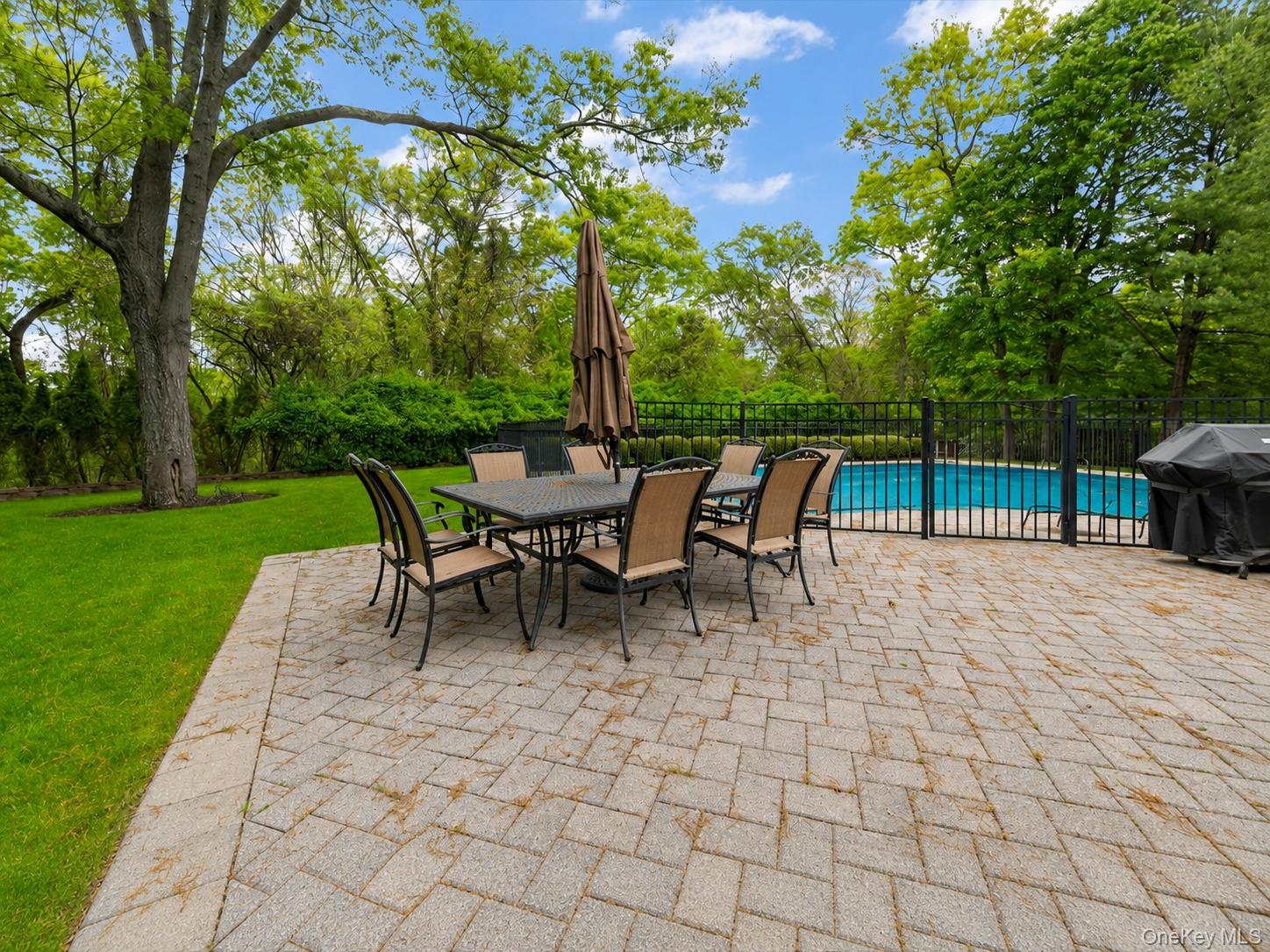 6 Apex Road Melville, NY 11747 - Photo 41 of 50 a view of a patio with a table and chairs