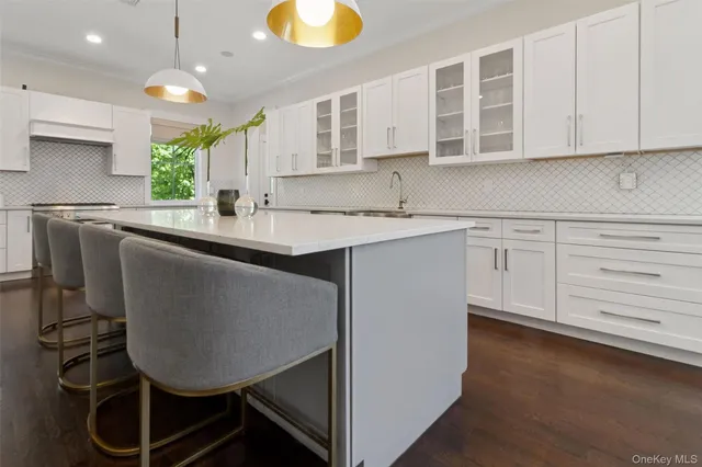 a kitchen with a sink cabinets and window