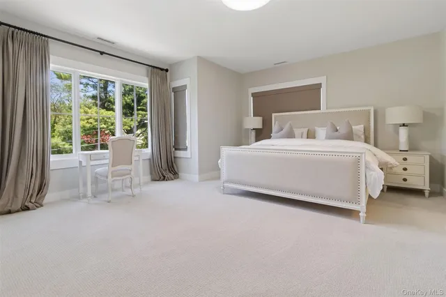 a room with a bed and a chair