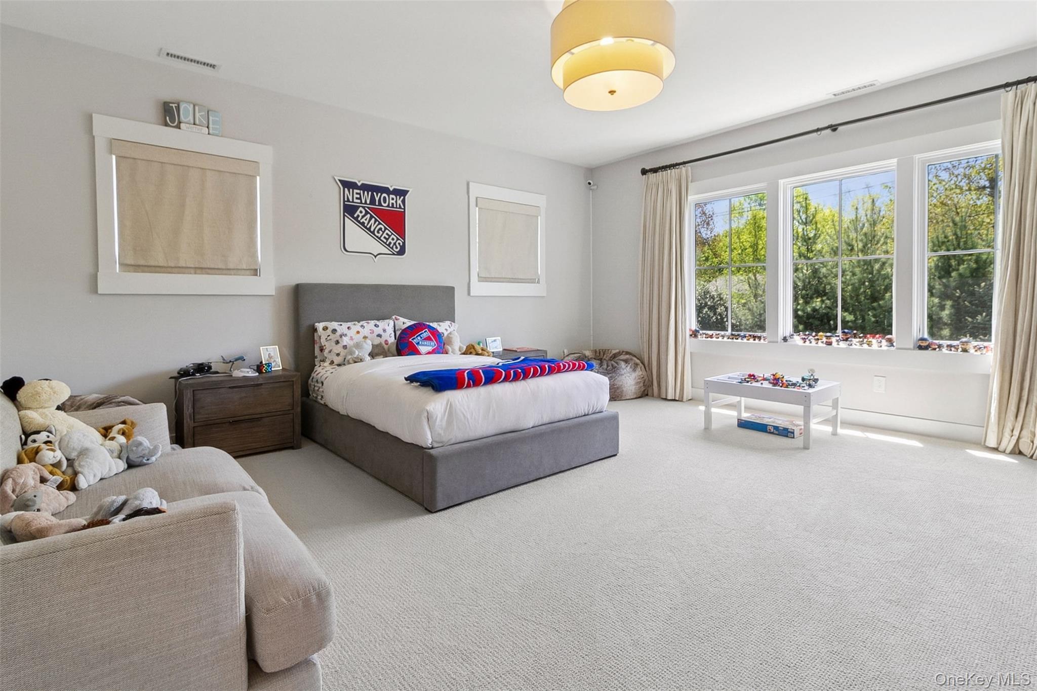 1 Stonewall Lane Mamaroneck, NY 10543 - Photo 17 of 33 a bedroom with a bed and a couch