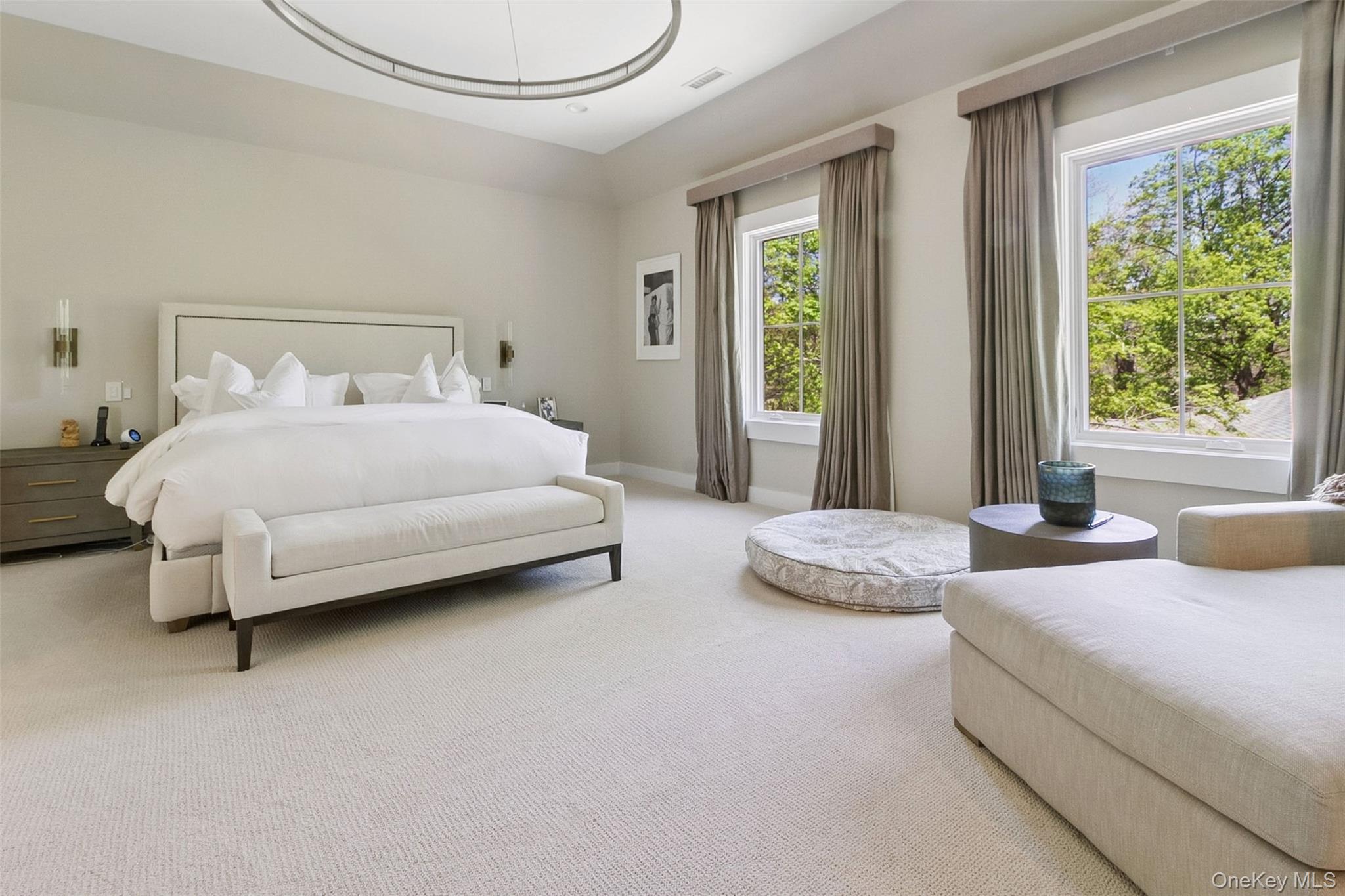 1 Stonewall Lane Mamaroneck, NY 10543 - Photo 19 of 33 a spacious bedroom with two beds and large window