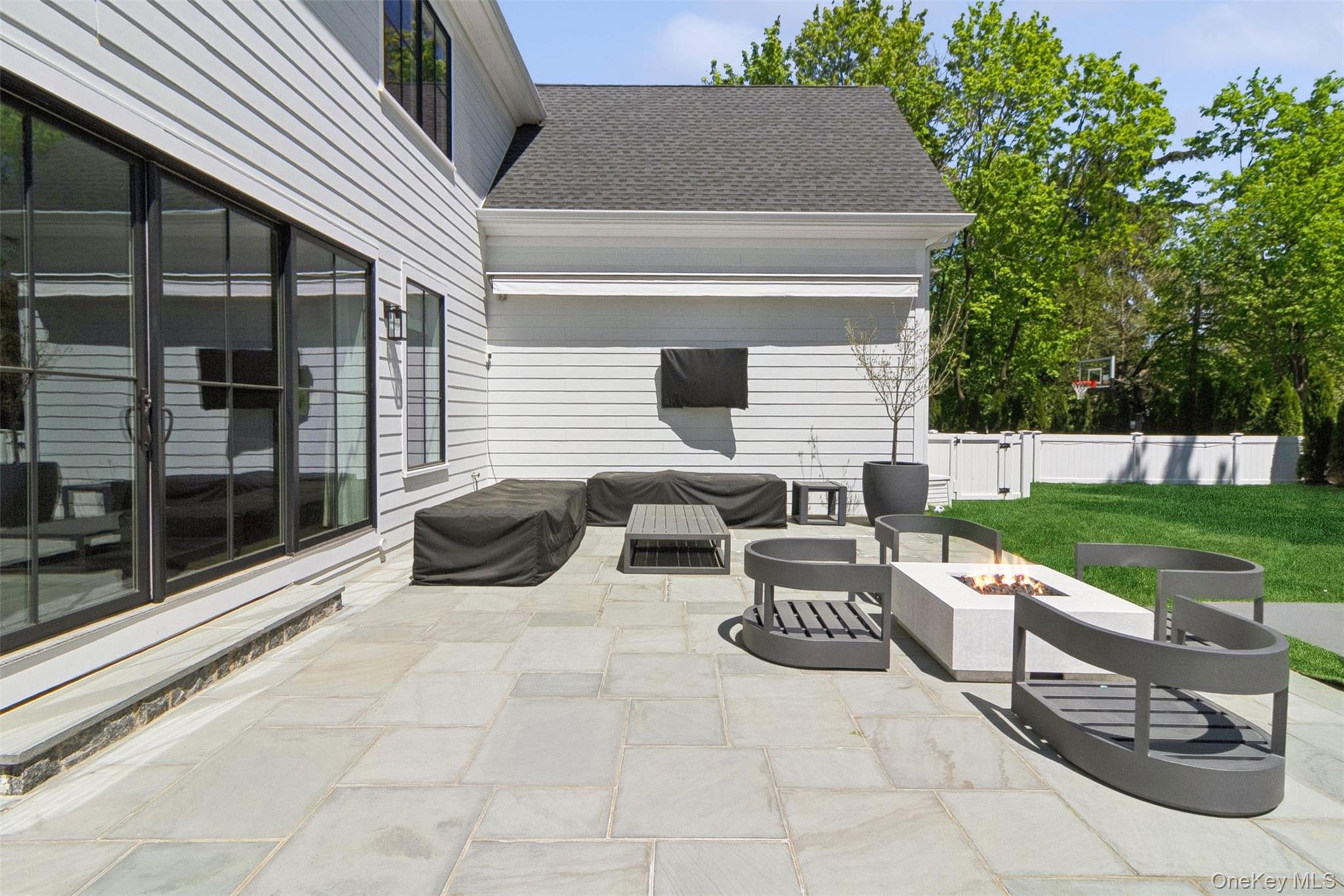 1 Stonewall Lane Mamaroneck, NY 10543 - Photo 25 of 33 a view of a patio with table and chairs and potted plants