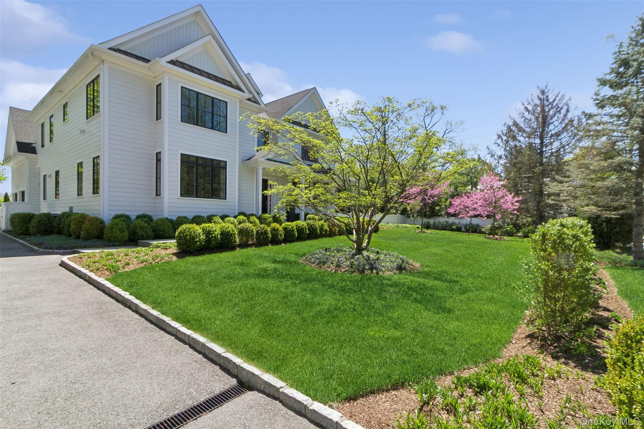 1 Stonewall Lane Mamaroneck, NY 10543 - Photo 26 of 33 a front view of a house with a yard