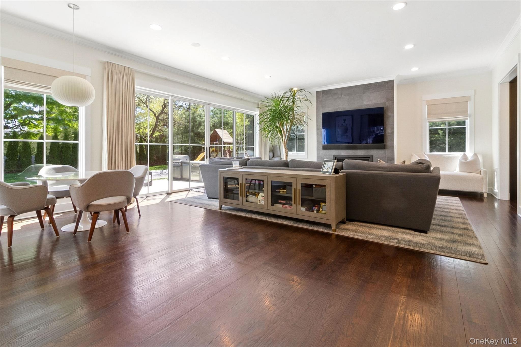 1 Stonewall Lane Mamaroneck, NY 10543 - Photo 10 of 33 a living room with furniture flat screen tv and a large window