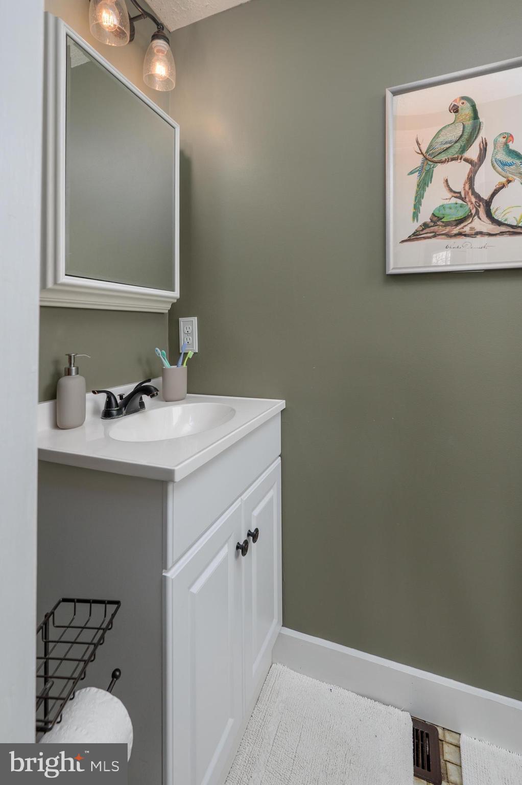 145 New Road Tabernacle, NJ 08088 - Photo 12 of 25 a bathroom with a sink and a mirror