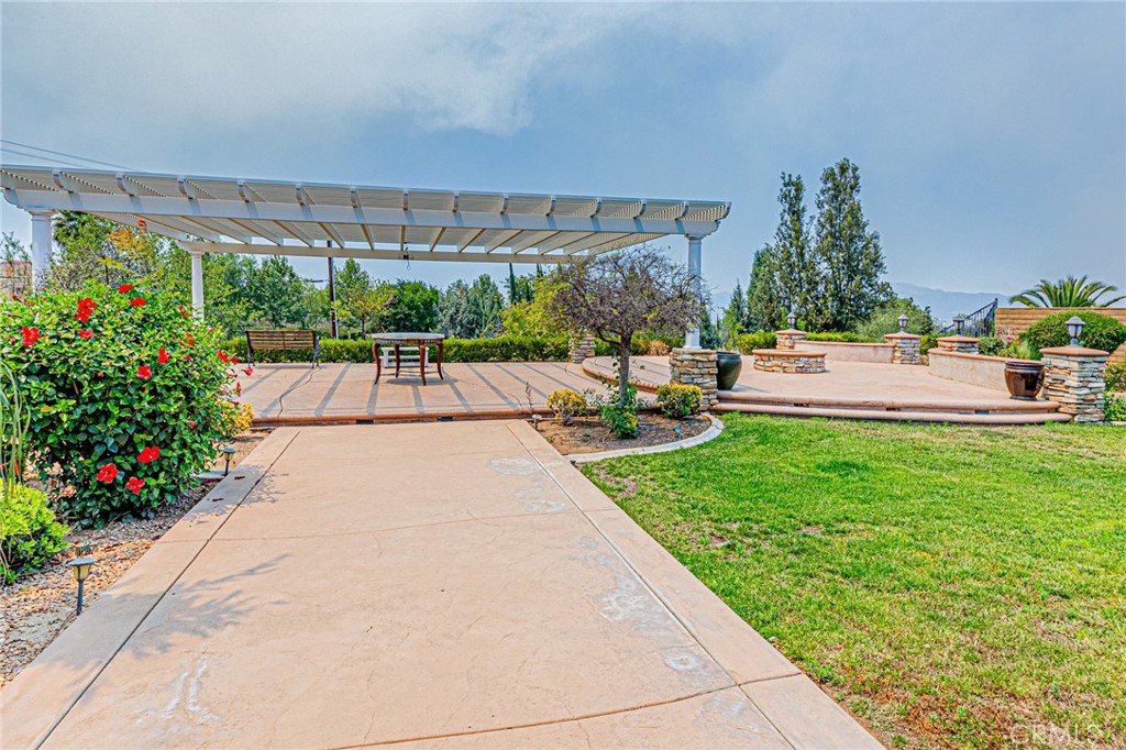 4088 Shady Ridge Circle Corona, CA 92881 - Photo 23 of 47 a view of swimming pool with outdoor seating and plants