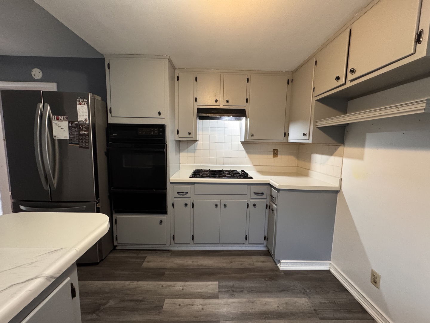 403 Michigan Avenue Aurora, IL 60506 - Photo 5 of 12 a kitchen with a refrigerator and cabinets