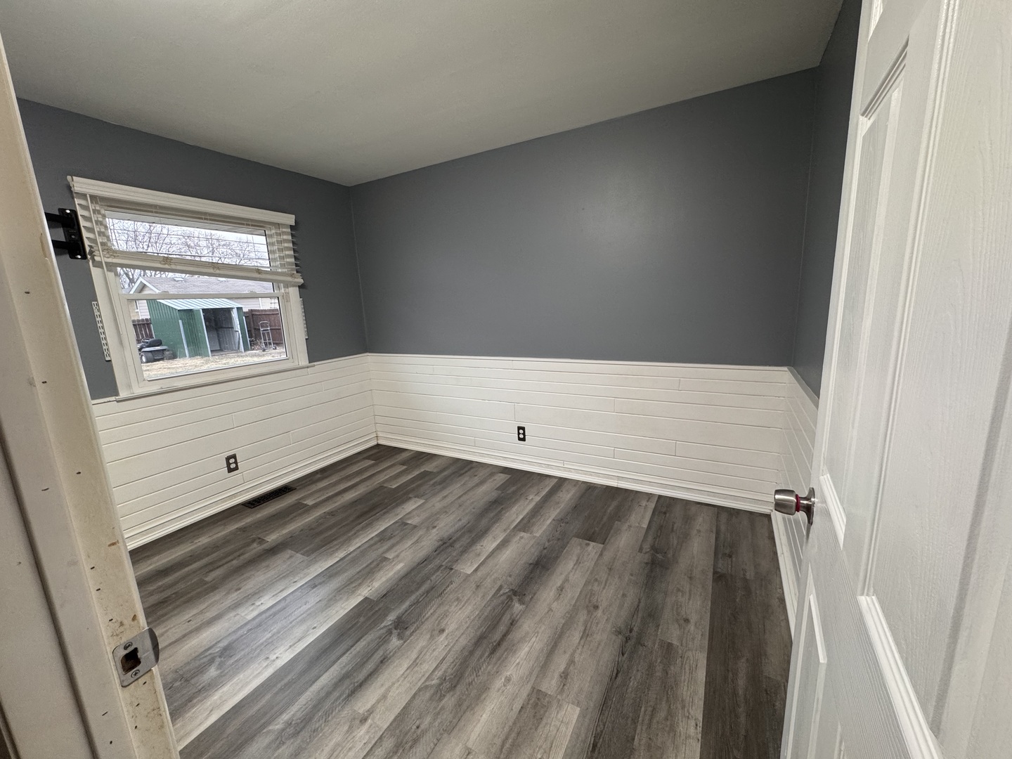403 Michigan Avenue Aurora, IL 60506 - Photo 7 of 12 view of a room with wooden floor and window