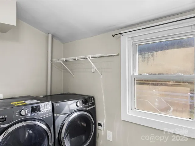 a view of a house with wooden deck