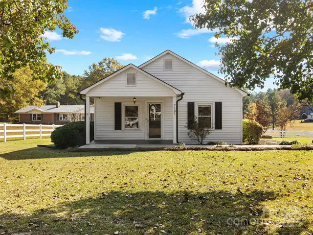 a front view of a house with yard