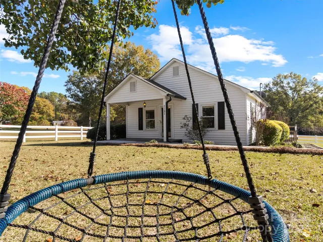 a view of swimming pool with a lounge chairs