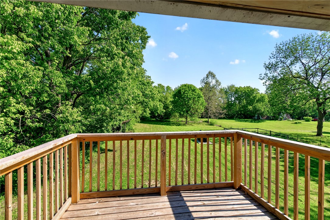 2684 Arthur Road Springfield, OH 45502 - Photo 48 of 69 Step outside onto the deck and enjoy peaceful views of the expansive green landscape.