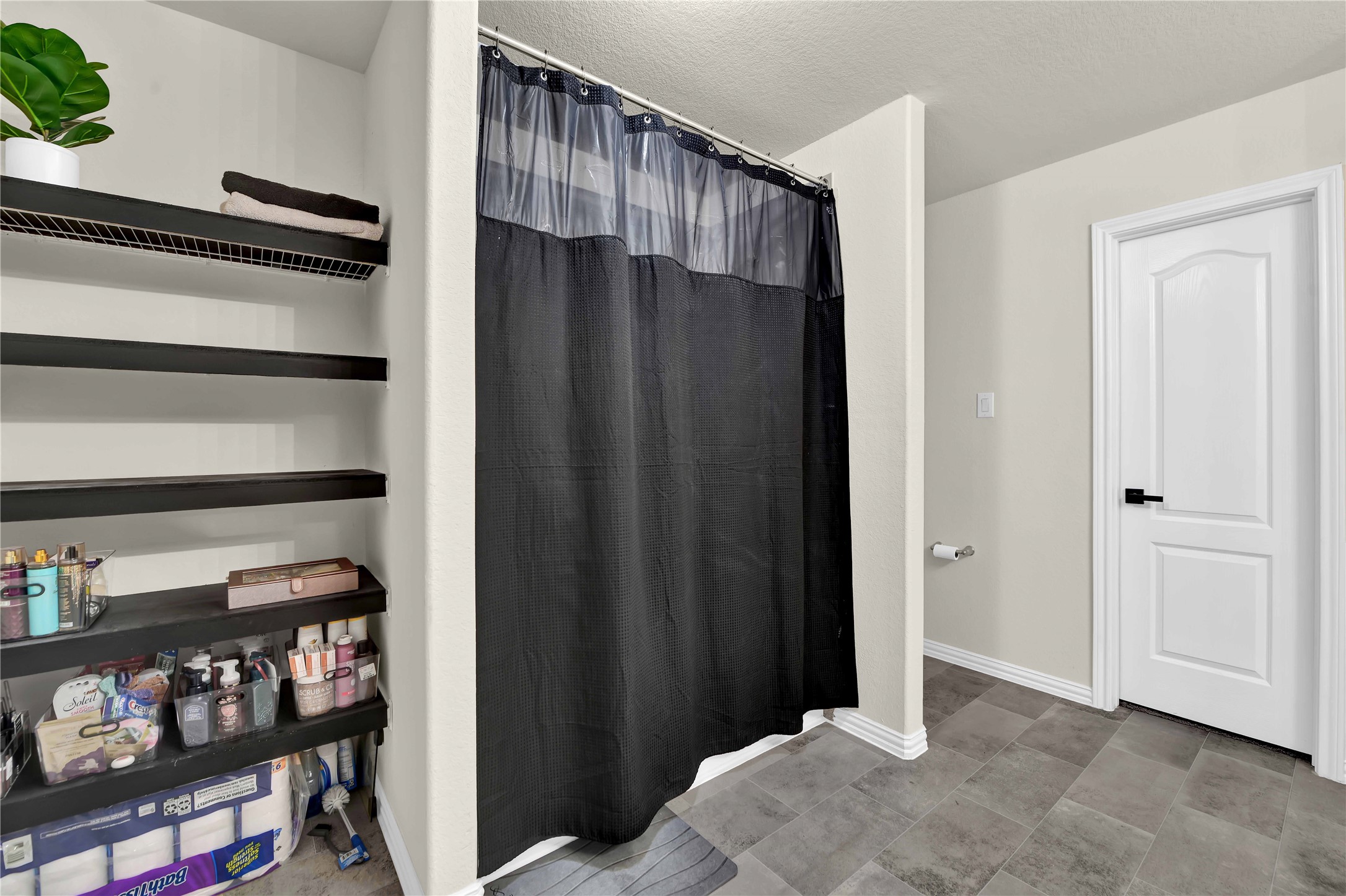 17703 Lion Heart Road Conroe, TX 77306 - Photo 17 of 26 a view of a bedroom with shelf and closet