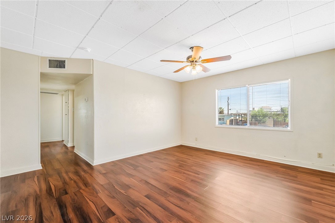 2 California Way Henderson, NV 89015 - Photo 6 of 29 Rich MMW floors complement this versatile room with ample natural light.