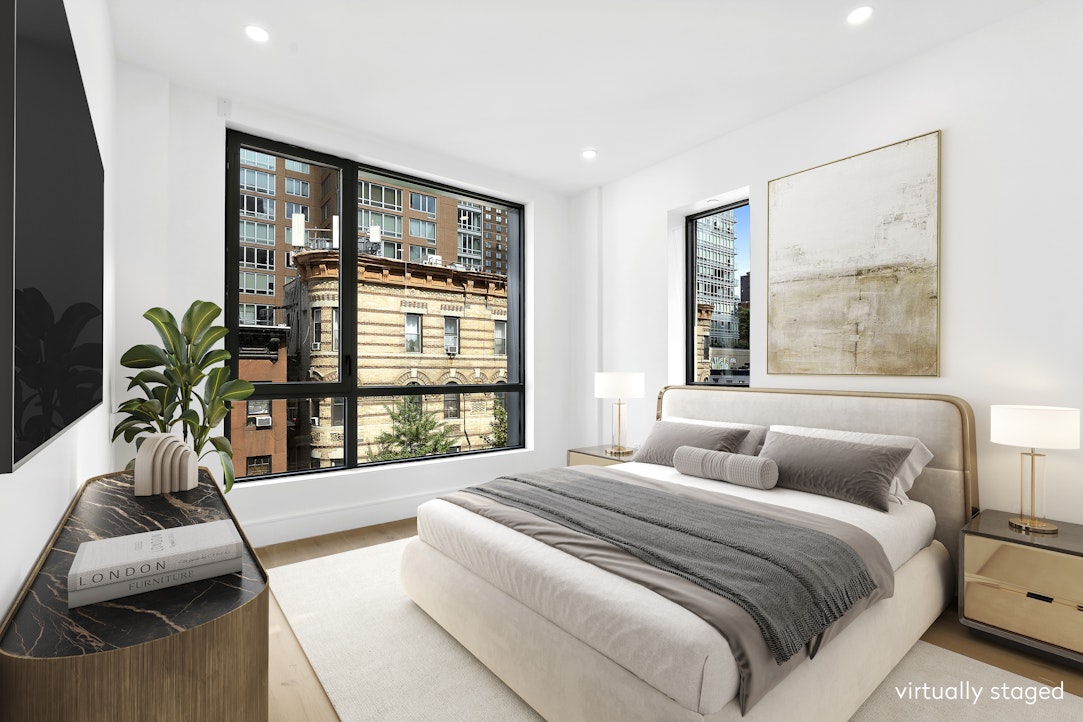 244 East 52nd Street, Unit PH7 Manhattan, NY 10022 - Photo 11 of 23 a spacious bedroom with a large bed and a large window