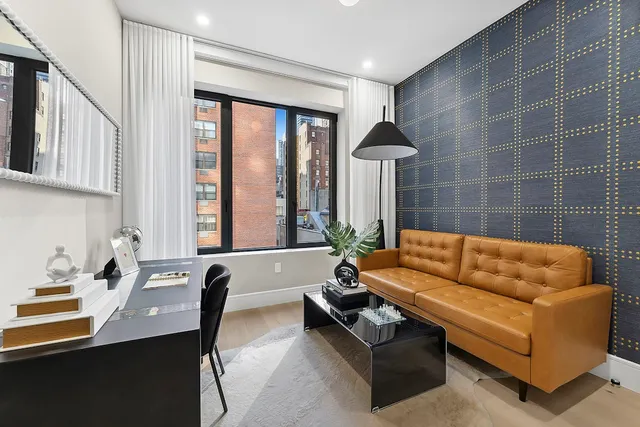 a bathroom with a toilet sink and shower