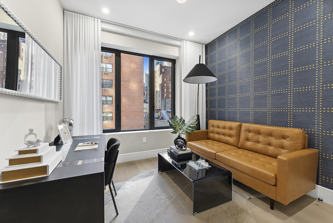 244 East 52nd Street, Unit PH7 Manhattan, NY 10022 - Photo 15 of 23 a living room with furniture and a large window