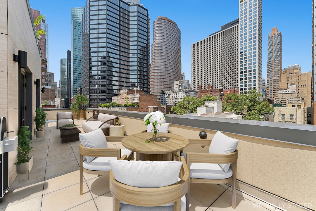 244 East 52nd Street, Unit PH7 Manhattan, NY 10022 - Photo 7 of 23 a outdoor living space with furniture and a potted plant