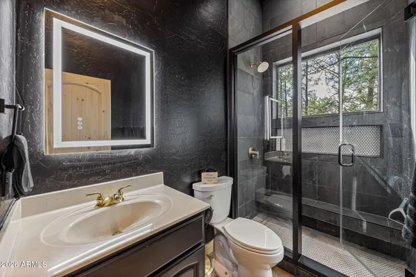 a bathroom with a tub and a shower