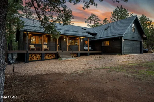 a view of a house with a yard and garage