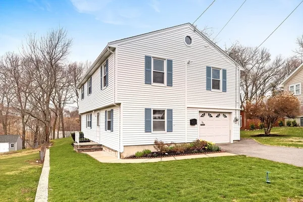 a front view of a house with a yard