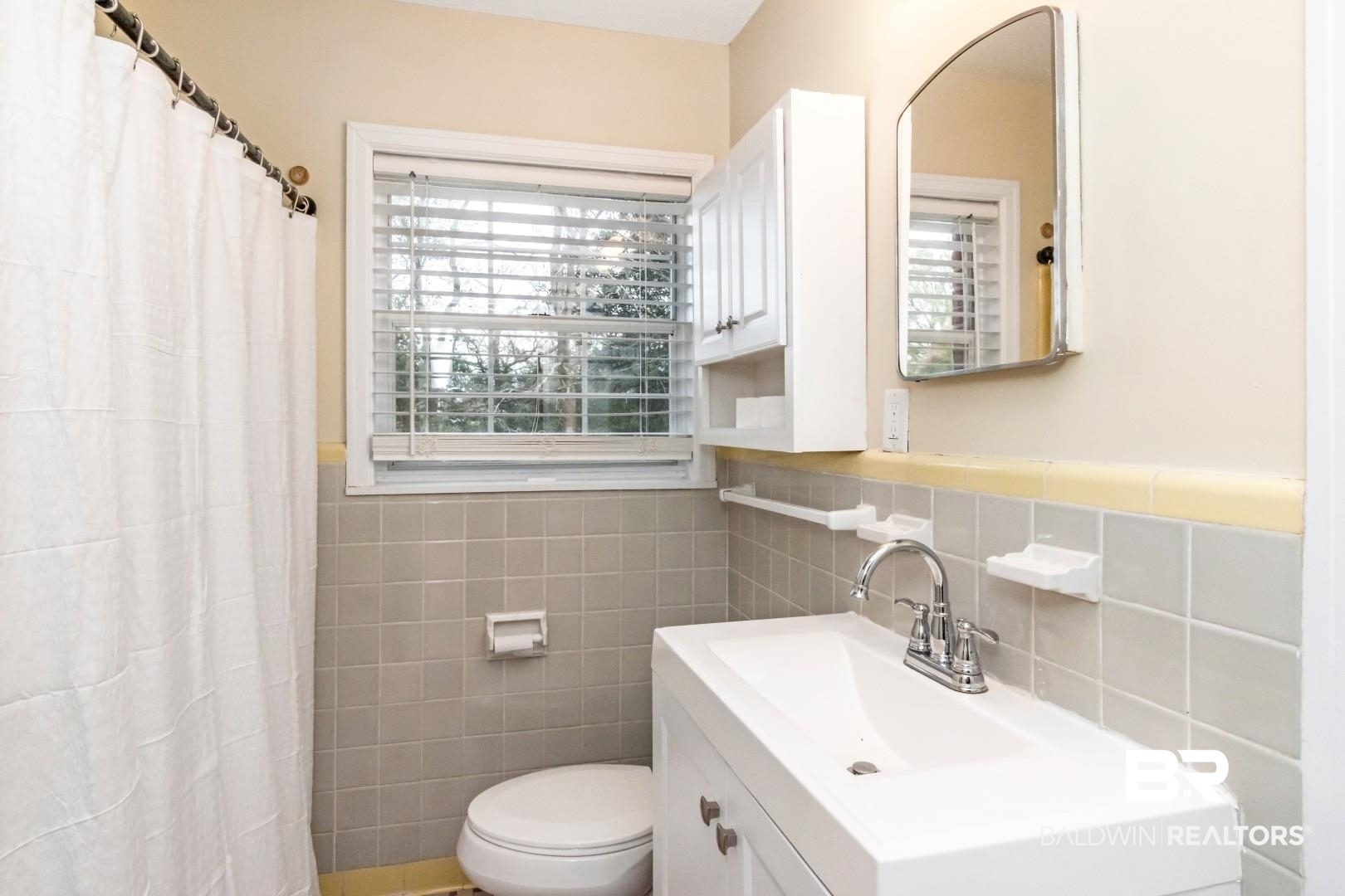 61 Nack Lane Mobile, AL 36608 - Photo 11 of 25 Bathroom featuring vanity, toilet, a shower with shower curtain, and tile walls