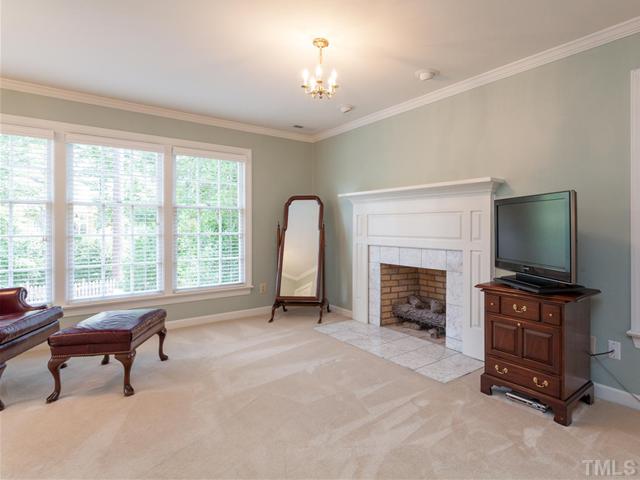 1917 Prescott Place Raleigh, NC 27615 - Photo 14 of 25 The master suite's gas fireplace features a marble surround and a distinctive mantel.