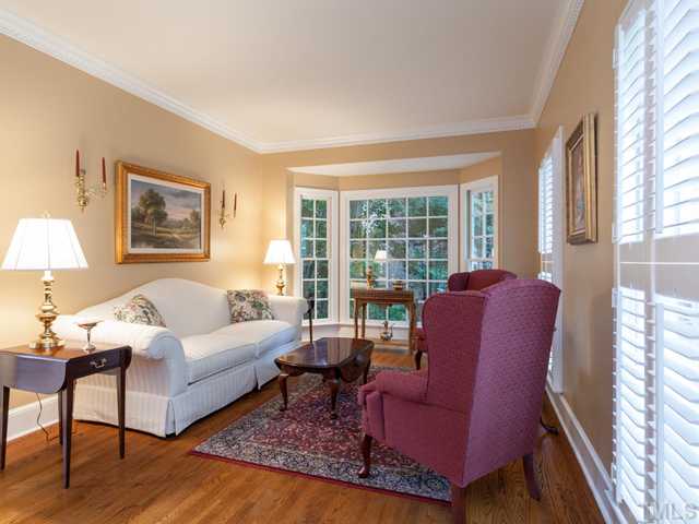 1917 Prescott Place Raleigh, NC 27615 - Photo 4 of 25 The versatile living room can also be utilized as beautiful home office. This room offers hardwood floors, crown molding and plantation shutters. A set of French doors lead from the living room to the family room.