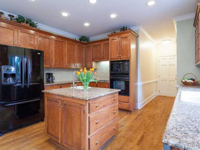 1917 Prescott Place Raleigh, NC 27615 - Photo 8 of 25 You will appreciate the large work island with wine rack and the abundant cabinet storage. There is a vegetable sink in the island.