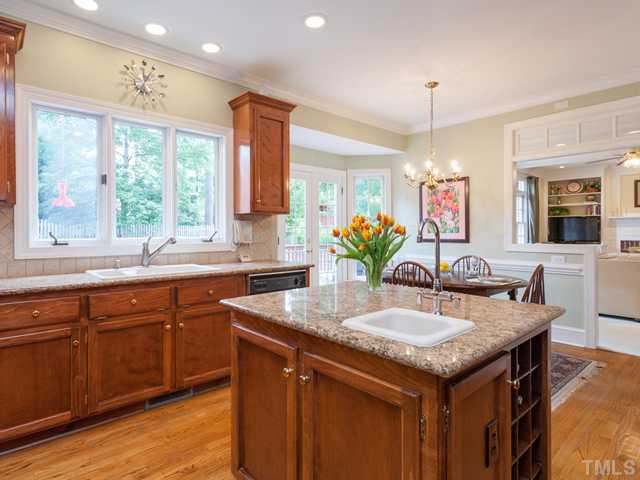 1917 Prescott Place Raleigh, NC 27615 - Photo 9 of 25 The kitchen is filled with light from both the wall of windows over the sink and the numerous canned lights.
