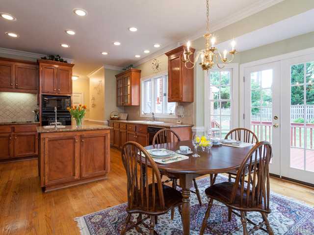 1917 Prescott Place Raleigh, NC 27615 - Photo 10 of 25 Double French doors lead from the breakfast room to the expansive deck.