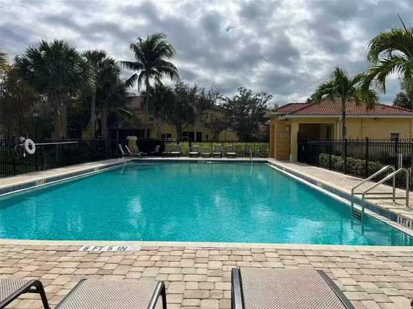 a view of a swimming pool with a patio