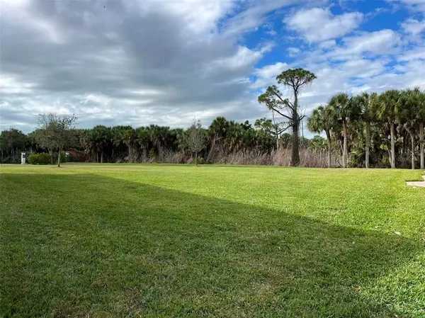a front view of a house with a big yard