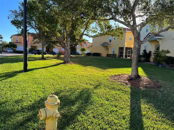 a view of a fountain with tree s