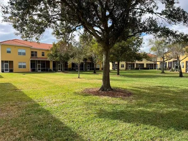 a view of a trees in front of a building