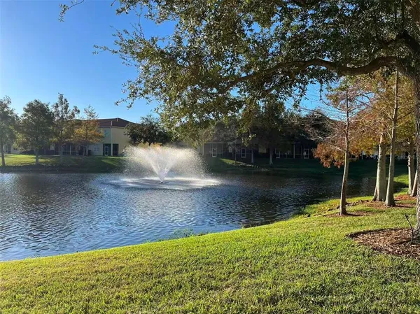 a view of a lake with a yard