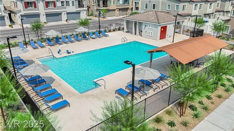 7308 North Decatur Boulevard, Unit 4 North Las Vegas, NV 89084 - Photo 31 of 34 Community pool with a patio and a residential view
