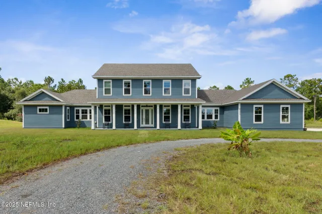 a house with swimming pool in front of it