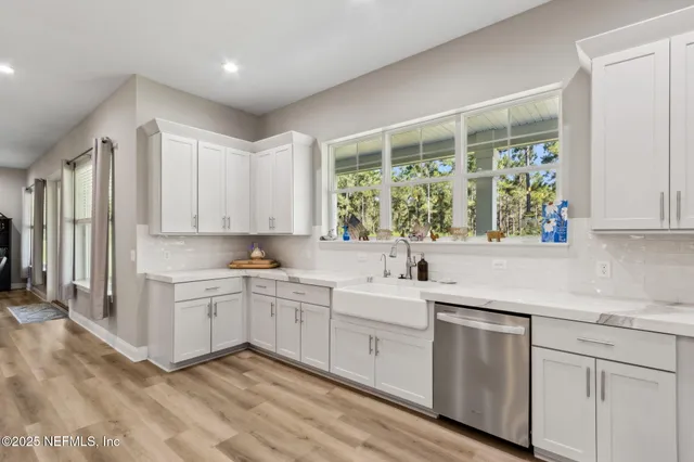 a bedroom with two beds and a chandelier