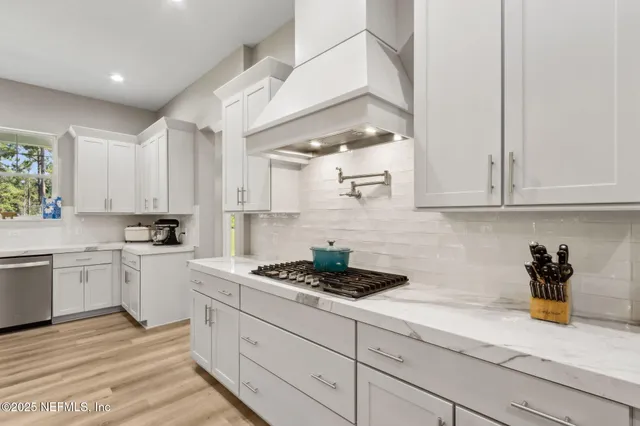 a view of a hallway view with wooden floor and living room