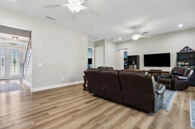 a en suite bathroom with a sink double vanity granite and a shower