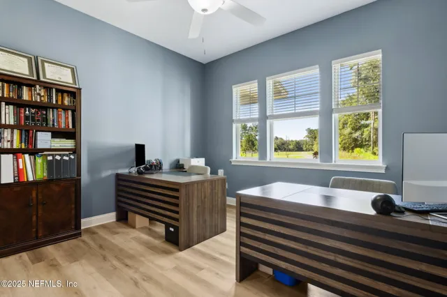 a backyard of a house with barbeque oven table and chairs