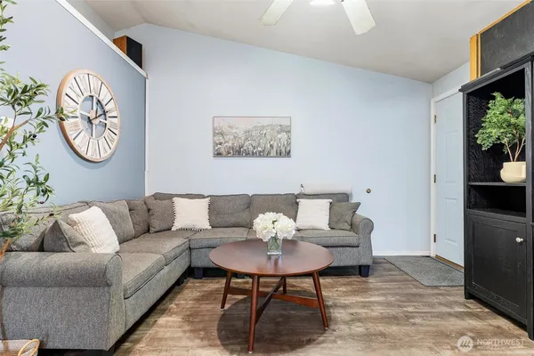 a living room with furniture and a window