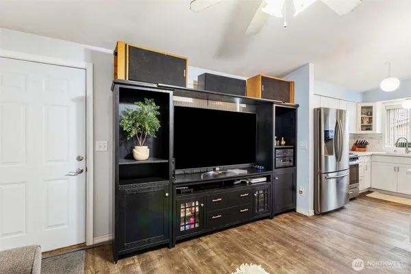 a room with furniture and flat screen tv