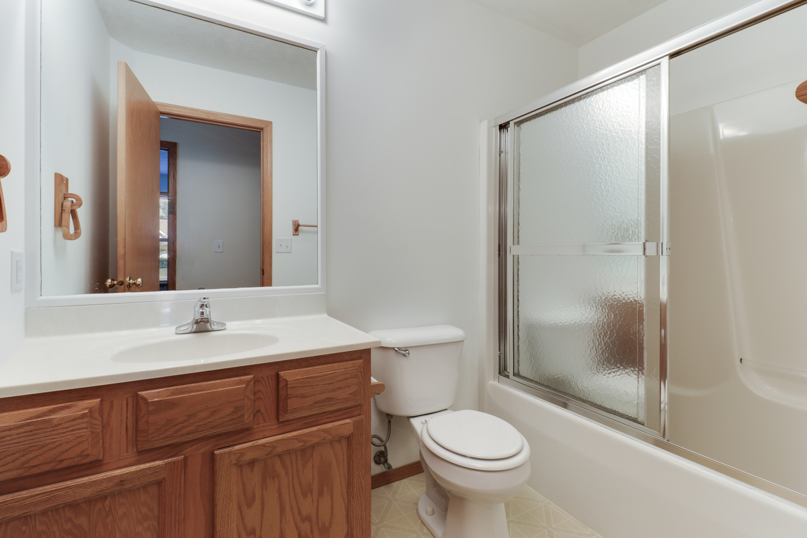 205 Martin Street Normal, IL 61761 - Photo 15 of 32 a bathroom with a sink and a mirror